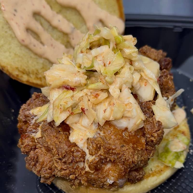 Fried chipotle chicken sandwich with pepper jack cheese, lettuce, and pickles