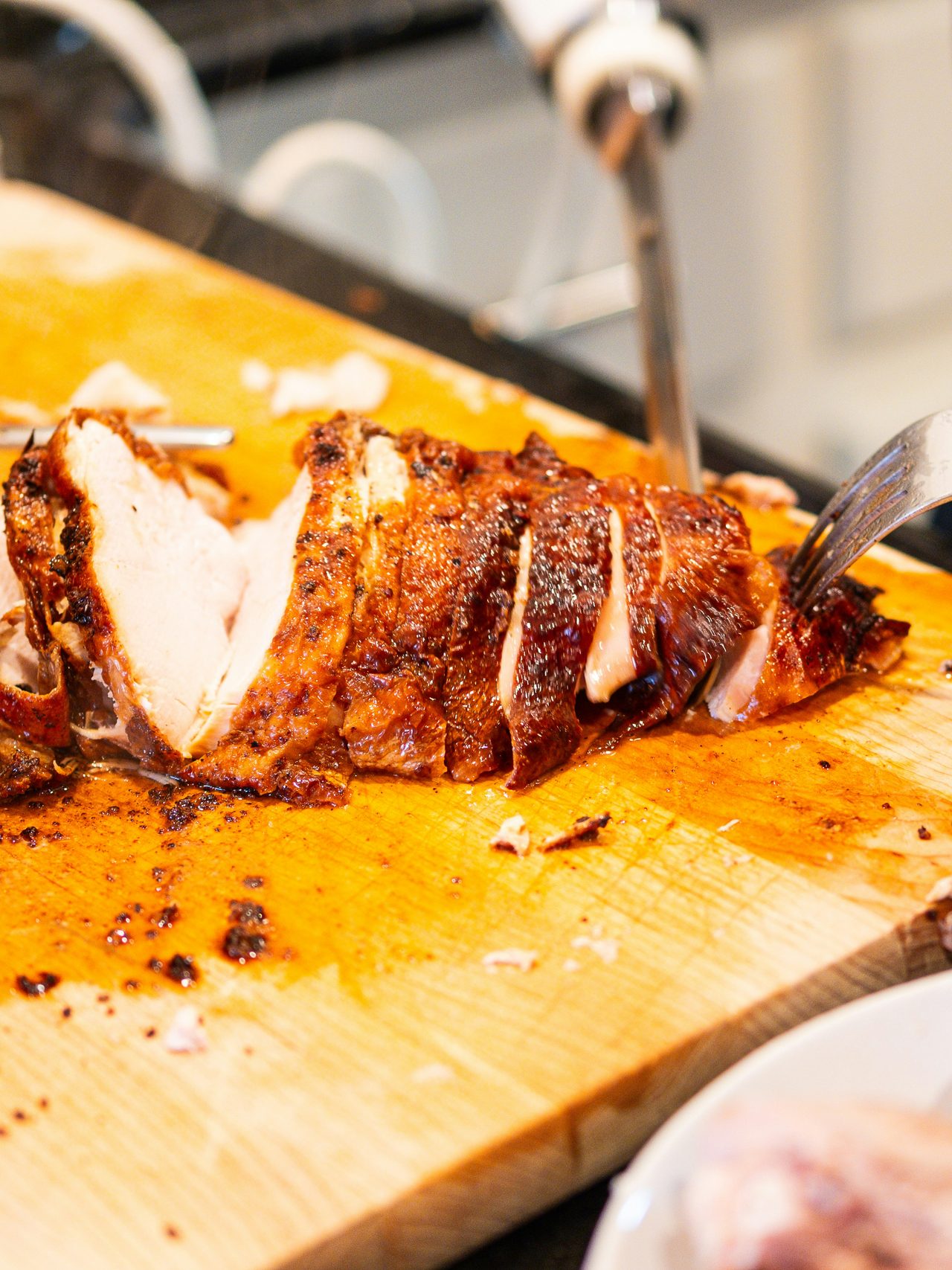 Carved roast turkey sliced on a cutting board